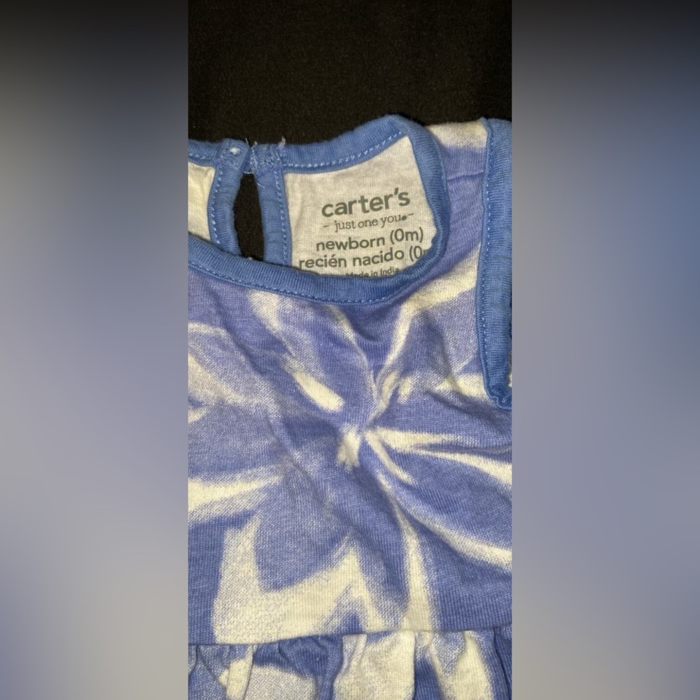 Worn Once. Newborn baby girl. The colors are blue and white.